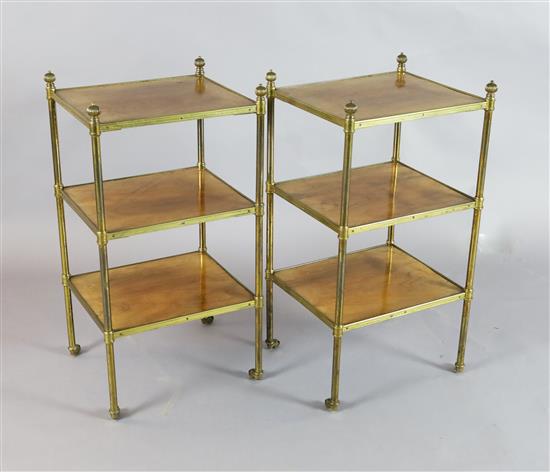 A pair of early 20th century tubular brass and walnut three tier etageres, W.1ft 3in. D.1ft 1in. H.2ft 4in.